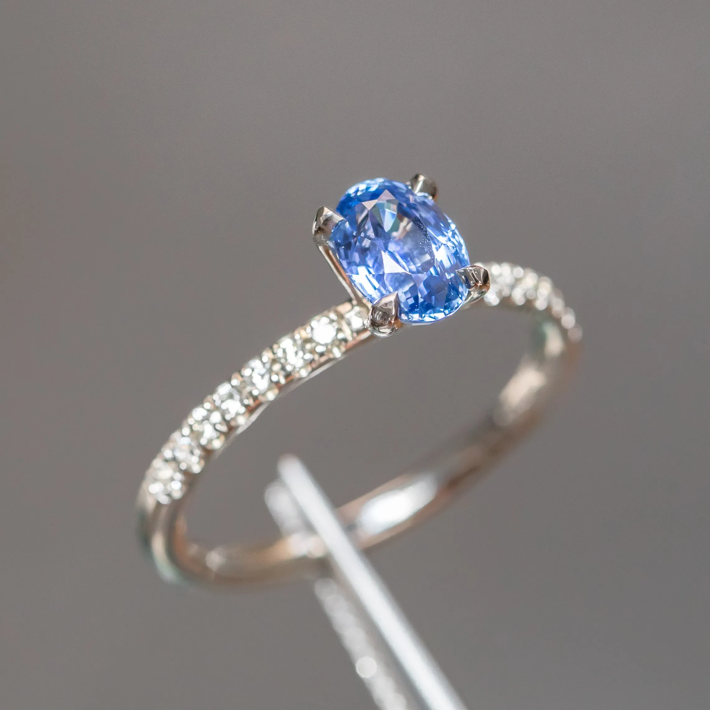 1.12ct Oval Periwinkle Blue Sapphire Solitaire with French Set Diamonds In 14K White Gold