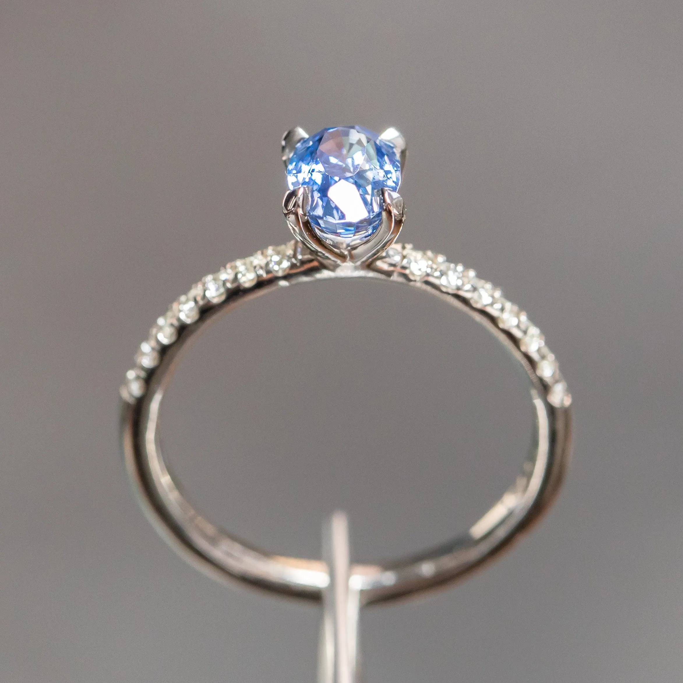 1.12ct Oval Periwinkle Blue Sapphire Solitaire with French Set Diamonds In 14K White Gold