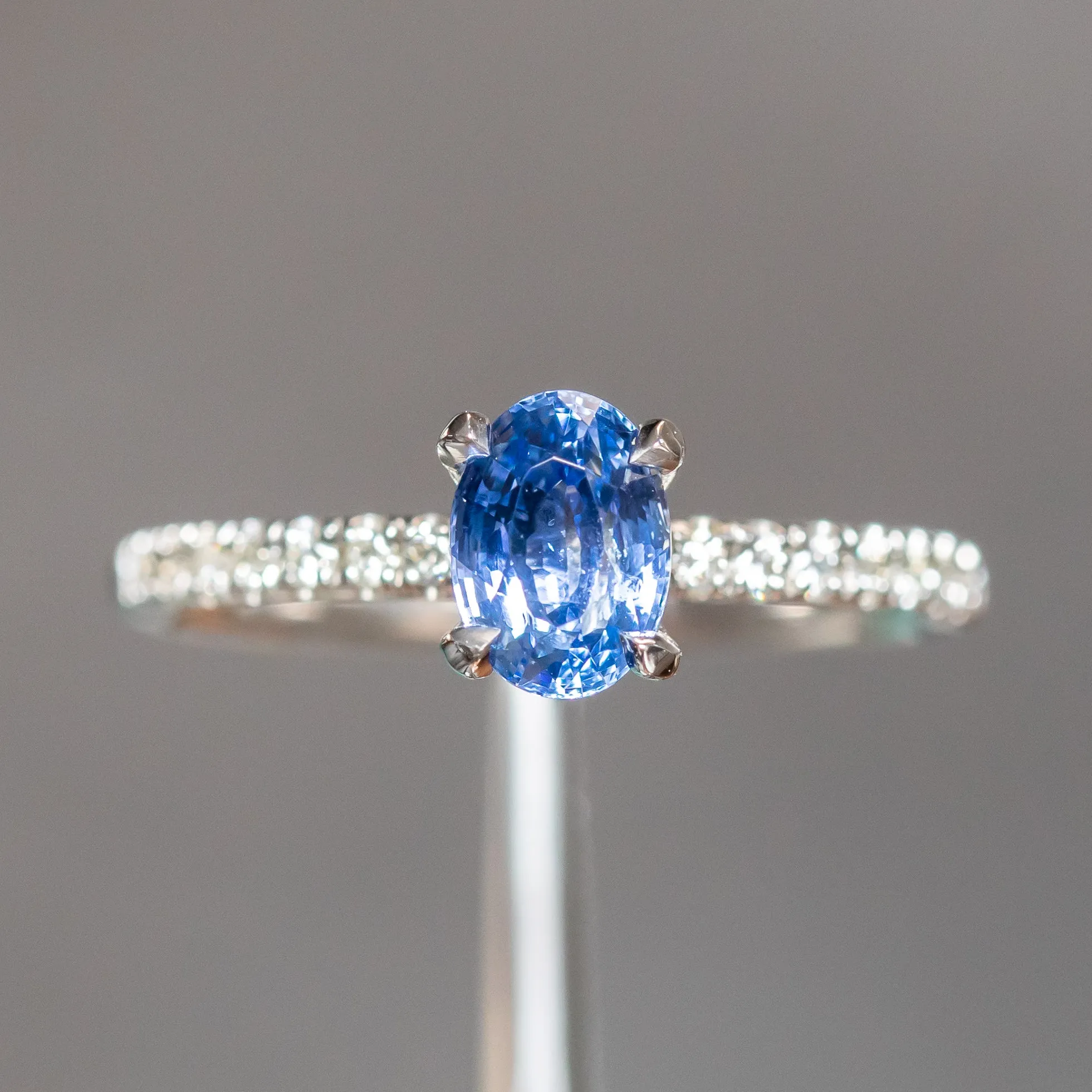 1.12ct Oval Periwinkle Blue Sapphire Solitaire with French Set Diamonds In 14K White Gold